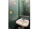 Pedestal sink with mirror in a powder room with decorative squares on the walls at 10072 Graceful Landing Dr, Indianapolis, IN 46234