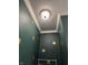 Ceiling in a green powder room with crown moulding and decorative accents at 10072 Graceful Landing Dr, Indianapolis, IN 46234
