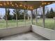 Relaxing screened porch with views of landscaped backyard at 10072 Graceful Landing Dr, Indianapolis, IN 46234