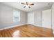 Bedroom features hardwood floors, a ceiling fan, closet and a large window at 1114 S Avon Ave, Avon, IN 46123