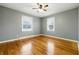 Bedroom features hardwood floors, neutral walls, and two windows providing great natural light at 1114 S Avon Ave, Avon, IN 46123