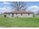 Single story home with a brown roof, brick exterior, and a large yard at 1114 S Avon Ave, Avon, IN 46123