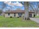 Charming single-story home featuring a stone facade, attached garage, and well-manicured lawn at 1114 S Avon Ave, Avon, IN 46123