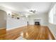 Bright living room with hardwood floors, fresh paint, fireplace and large windows at 1114 S Avon Ave, Avon, IN 46123