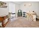 Carpeted bedroom featuring a window, vanity, and a mix of decor and furniture at 118 W Fordice St, Lebanon, IN 46052
