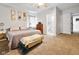 Inviting bedroom featuring neutral tones, carpet, ensuite bathroom, and lots of natural light at 118 W Fordice St, Lebanon, IN 46052