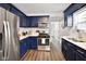 Beautiful kitchen with stainless steel appliances, navy blue cabinets, and white countertops at 118 W Fordice St, Lebanon, IN 46052