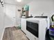 Bright laundry room is equipped with modern washer and dryer units, and convenient storage at 118 W Fordice St, Lebanon, IN 46052