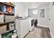 This laundry room is equipped with modern appliances, including a washer and dryer and shelving at 118 W Fordice St, Lebanon, IN 46052