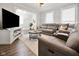 Inviting living room featuring a large sofa, modern decor, and natural light at 118 W Fordice St, Lebanon, IN 46052