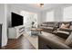 Inviting living room featuring a large sofa, modern decor, and natural light at 118 W Fordice St, Lebanon, IN 46052