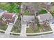 Aerial view of a well-manicured property highlighting the home's roof, driveway, and surrounding greenery at 12527 Trester Ln, Fishers, IN 46038