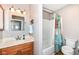 Well-lit bathroom with a shower/tub combo and a single sink vanity with neutral tones and a shower curtain at 12527 Trester Ln, Fishers, IN 46038