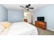 Cozy bedroom with a queen bed, a dresser with a television, and an ensuite bathroom for added convenience at 12527 Trester Ln, Fishers, IN 46038
