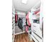 Organized walk-in closet boasts ample shelving, drawers, and hanging space for optimal storage and style at 12527 Trester Ln, Fishers, IN 46038