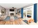 Comfortable living room features a fireplace, wood floors, and patio access with seating nearby at 12527 Trester Ln, Fishers, IN 46038