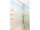 Modern shower featuring sleek glass door, white tile, and chrome fixtures creates a spa-like retreat at 12527 Trester Ln, Fishers, IN 46038