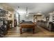 Spacious basement with a pool table, bar, seating area, and modern flooring at 12897 Queens Troop, Carmel, IN 46032