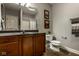 Bathroom featuring a vanity with dark wood cabinets, toilet, and a shower/tub combo at 12897 Queens Troop, Carmel, IN 46032