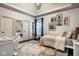 Stylish bedroom with modern artwork, a cozy reading nook, and custom shelving for storage at 12897 Queens Troop, Carmel, IN 46032