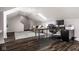 Bonus room has a convenient work area with a skylight that provides ample natural light and dark flooring at 12897 Queens Troop, Carmel, IN 46032