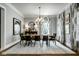 Elegant dining room featuring stylish decor, designer lighting, and hardwood floors at 12897 Queens Troop, Carmel, IN 46032