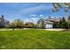 Large green lawn with view of the home and garage, situated in a desirable neighborhood at 12897 Queens Troop, Carmel, IN 46032