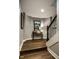 Inviting hallway featuring an accent wall with modern decor and access to the staircase at 12897 Queens Troop, Carmel, IN 46032