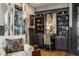 Well-lit home office with custom shelving, desk space, and comfortable seating at 12897 Queens Troop, Carmel, IN 46032