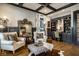 Sophisticated home office with built-in shelving, a comfortable chair, and ample workspace at 12897 Queens Troop, Carmel, IN 46032