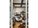 Stylish home office with a dark-trimmed ceiling, natural light, and elegant decor at 12897 Queens Troop, Carmel, IN 46032