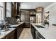 This kitchen features granite countertops, stainless steel appliances, and tile backsplash at 12897 Queens Troop, Carmel, IN 46032