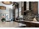 Kitchen with granite counters, stainless steel appliances, and designer lighting at 12897 Queens Troop, Carmel, IN 46032