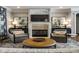 Cozy living room featuring a fireplace, comfortable seating, and stylish decor at 12897 Queens Troop, Carmel, IN 46032