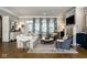 Bright and airy living room with hardwood floors, fireplace, and large windows at 12897 Queens Troop, Carmel, IN 46032