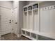 Functional mudroom features a built-in storage unit with hooks and baskets for easy organization at 12897 Queens Troop, Carmel, IN 46032
