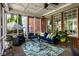 Enclosed sunroom featuring wicker furniture, outdoor plants, and natural light at 12897 Queens Troop, Carmel, IN 46032