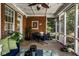 Inviting sunroom with brick walls, comfortable seating, and a ceiling fan for relaxing outdoor living at 12897 Queens Troop, Carmel, IN 46032