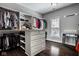 Organized walk-in closet with ample storage, custom shelving, and a stylish vanity area at 12897 Queens Troop, Carmel, IN 46032
