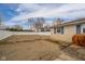 Spacious backyard with vinyl fencing and an attached garage at 140 Kim Dr, Anderson, IN 46012