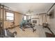 Finished basement features a home gym, fireplace, and TV area providing versatile space at 140 Kim Dr, Anderson, IN 46012