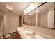 Bright bathroom featuring double sinks, large mirror, and a bathtub-shower combo at 140 Kim Dr, Anderson, IN 46012