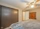 Bedroom with neutral walls, ceiling fan, and large closet providing ample storage at 140 Kim Dr, Anderson, IN 46012