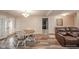 Bright dining area with a round table and comfortable seating adjacent to the cozy living area at 140 Kim Dr, Anderson, IN 46012