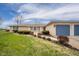 Charming ranch-style home with a brick facade, blue shutters, and an attached two-car garage at 140 Kim Dr, Anderson, IN 46012