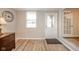 Welcoming hallway with hardwood floors, a hall closet, and natural lighting at 140 Kim Dr, Anderson, IN 46012
