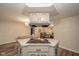 This kitchen features lots of cabinet space and an island cooktop at 140 Kim Dr, Anderson, IN 46012