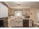 Well-lit kitchen showcases lots of cabinet space and modern appliances at 140 Kim Dr, Anderson, IN 46012