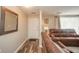 Inviting living room with a cozy leather sofa and well-lit foyer at 140 Kim Dr, Anderson, IN 46012