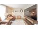 A welcoming living room boasts a large TV, comfortable seating and stylish decor at 140 Kim Dr, Anderson, IN 46012